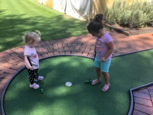 Kids Playing Mini Golf